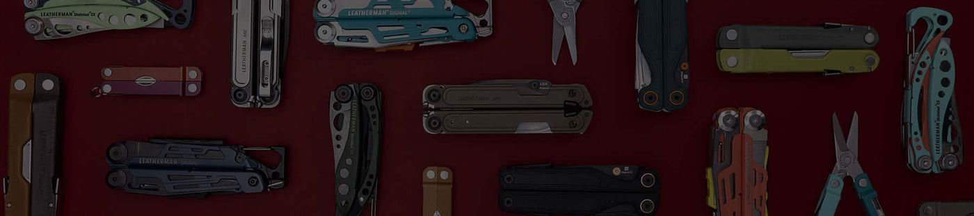 A collection of Leatherman multitools displayed on a red background, showcasing various designs and features.