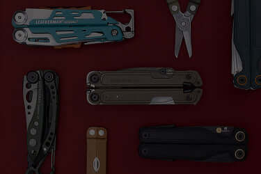 A collection of Leatherman multitools displayed on a red background, showcasing various designs and features.