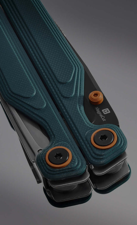 Translation missing: en.Leatherman Wave Alpha with orange and blue handle resting on a neutral background