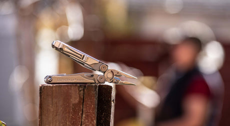 Translation missing: en.Leatherman Wave opened in pliers position laying on its side
