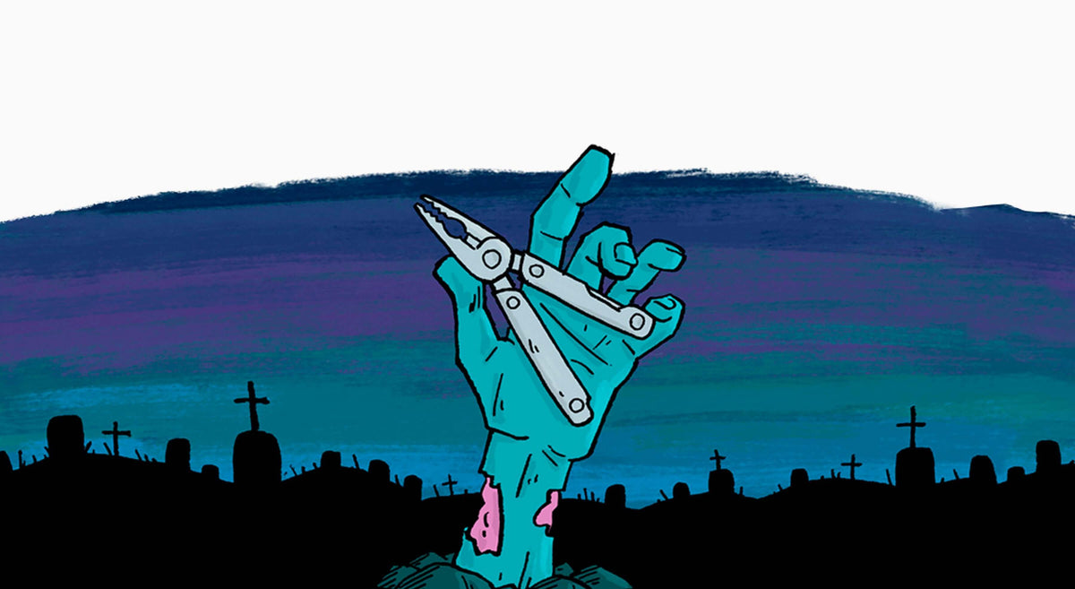 A zombie hand holding a multi-tool in a graveyard.