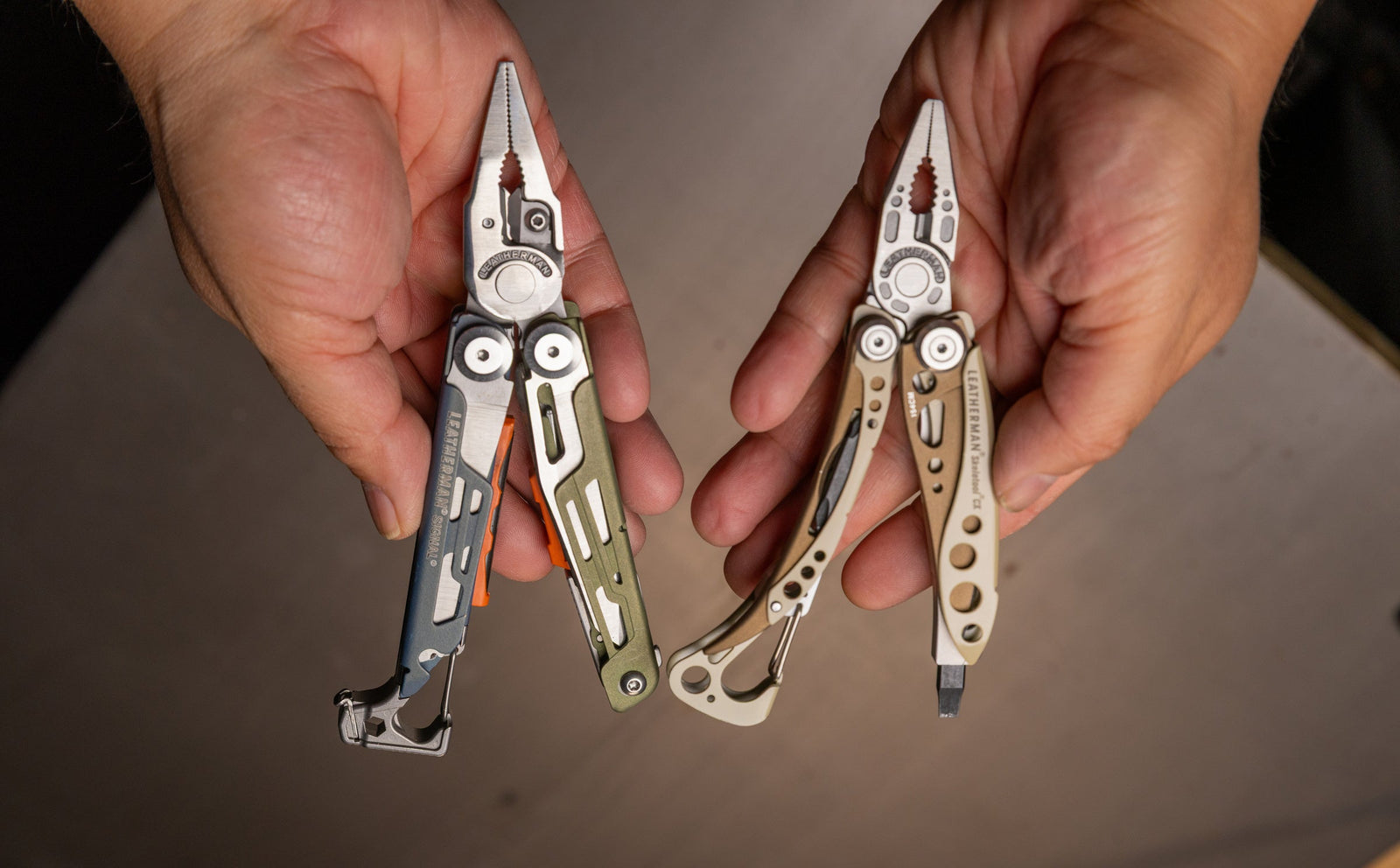 Translation missing: en.Two hands holding a Leatherman Signal and Leatherman Skeletool CX side by side in pliers position