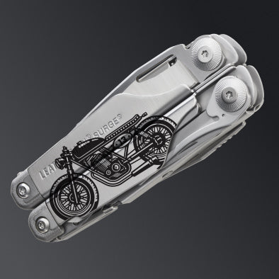 A Silver Leatherman Surge multi-tool customized with a motorcycle graphic.