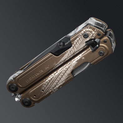 A Leatherman ARC Talos multi-tool customized with a tire tread graphic.