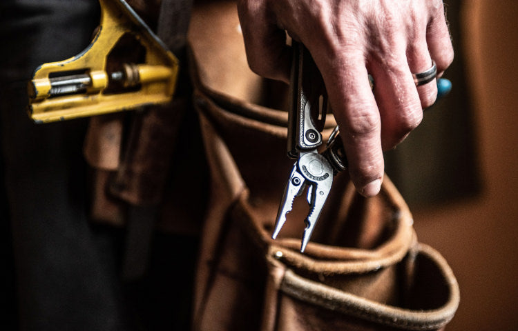 WORK - Leatherman pliers riding in a leather tool belt
