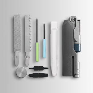 Translation missing: en.Batch #009: Adapter multitool components laid out, including files, saw, drivers, bits, and main tool body