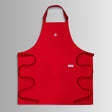 Translation missing: en.Red apron with neck strap, three front pockets, and long waist ties spread out flat