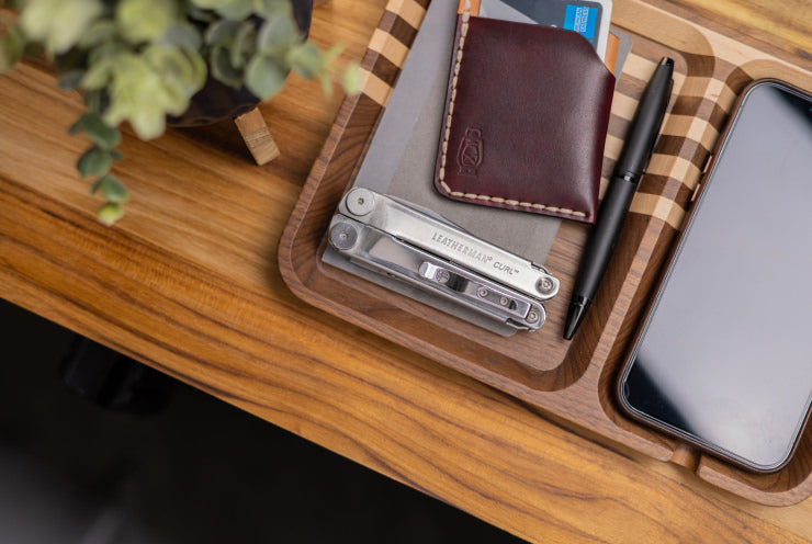 EVERYDAY - Leatherman on a desk tray beside wallet and phone