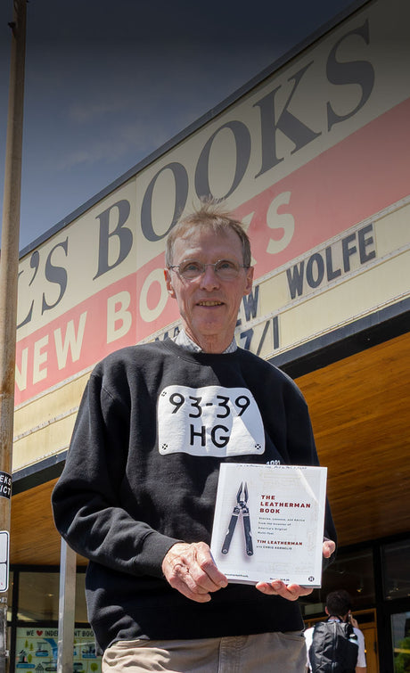 Translation missing: en.Tim Leatherman himself showcasing his book 'The Leatherman Book' in front of Powell's Book Store