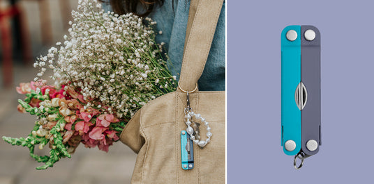 Translation missing: en.Two side-by-side images of a Leatherman Micra® in Lavender Mist color attached to a keychain hanging on a tote bag holding flowers and the closed back view of the Leatherman Micra®