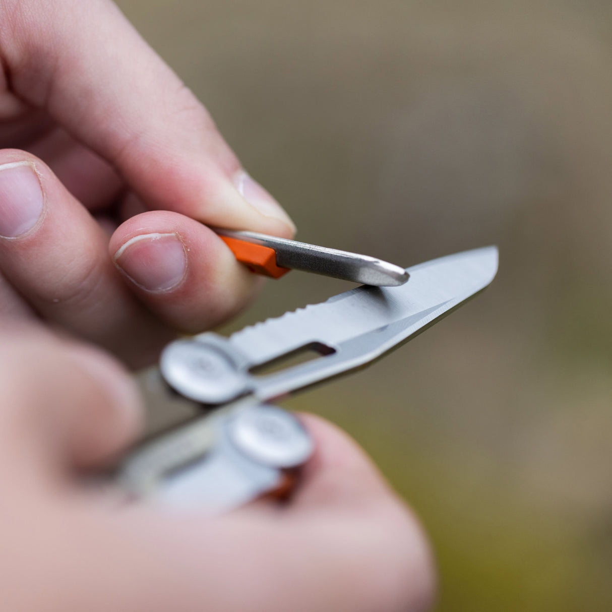 Translation missing: en.A person using the sharpener on a Mesa Verde Leatherman Signal® blade