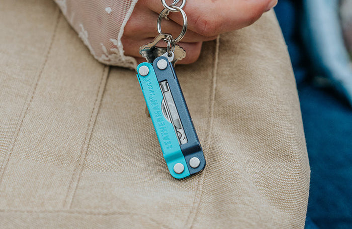 Translation missing: en.Leatherman Micra® in Lavender Mist color attached to a key ring showcasing its compact design