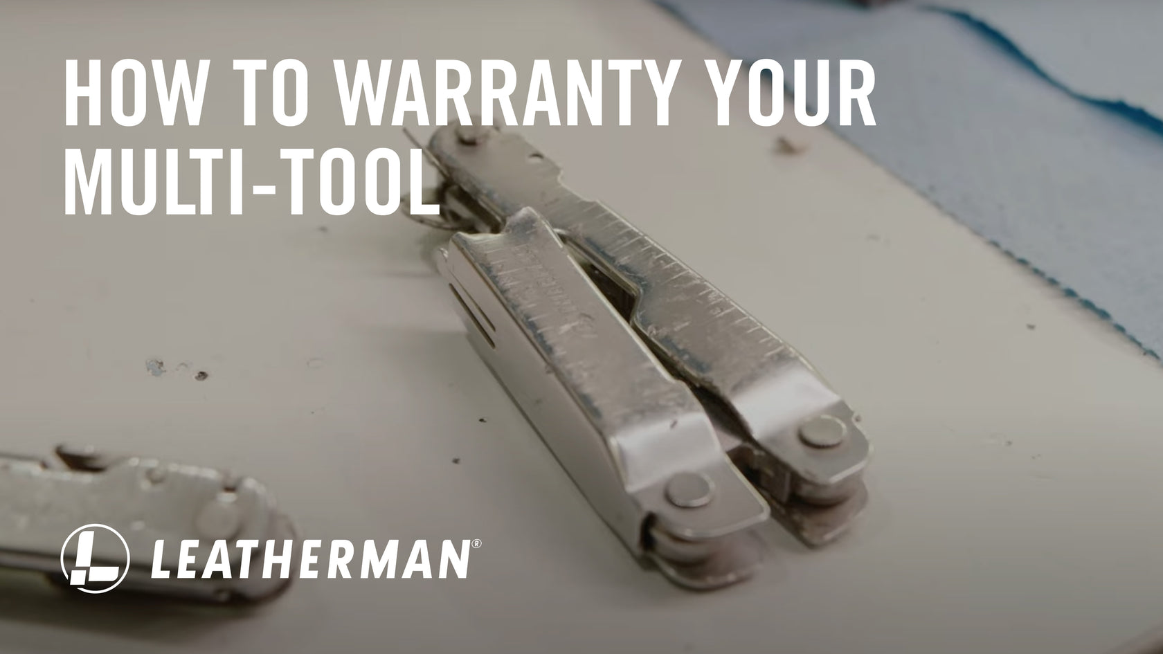 A close-up of a multi-tool on a work surface, with text overlay about warranty information from Leatherman.