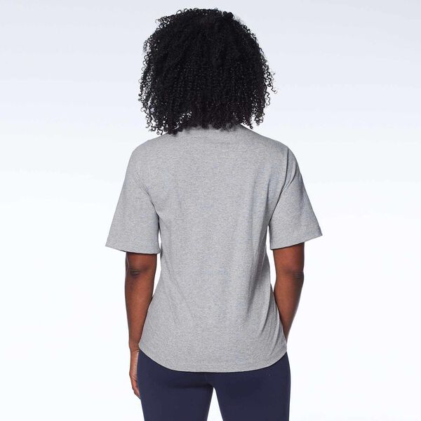 Gray short sleeve T-Shirt with PST badge on a model back