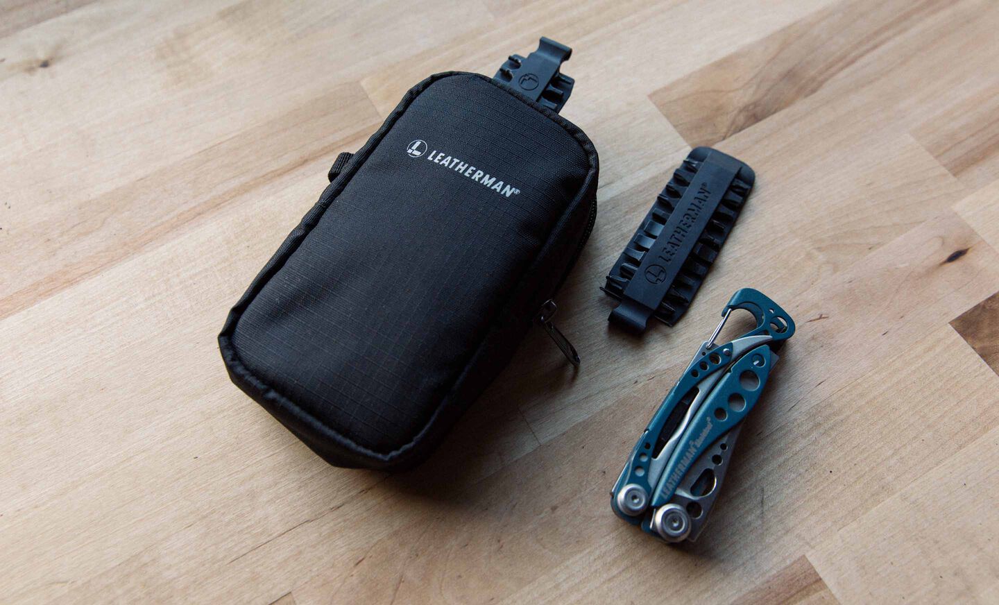 leatherman tool pouch next to Skeletool and Bit Kit