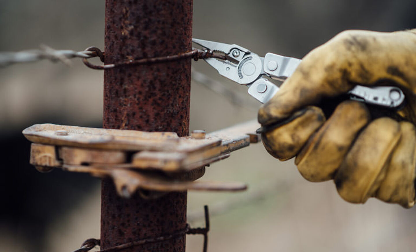 Leatherman stainless steel heritage rebar multi-tool in hand, cutting metal wire