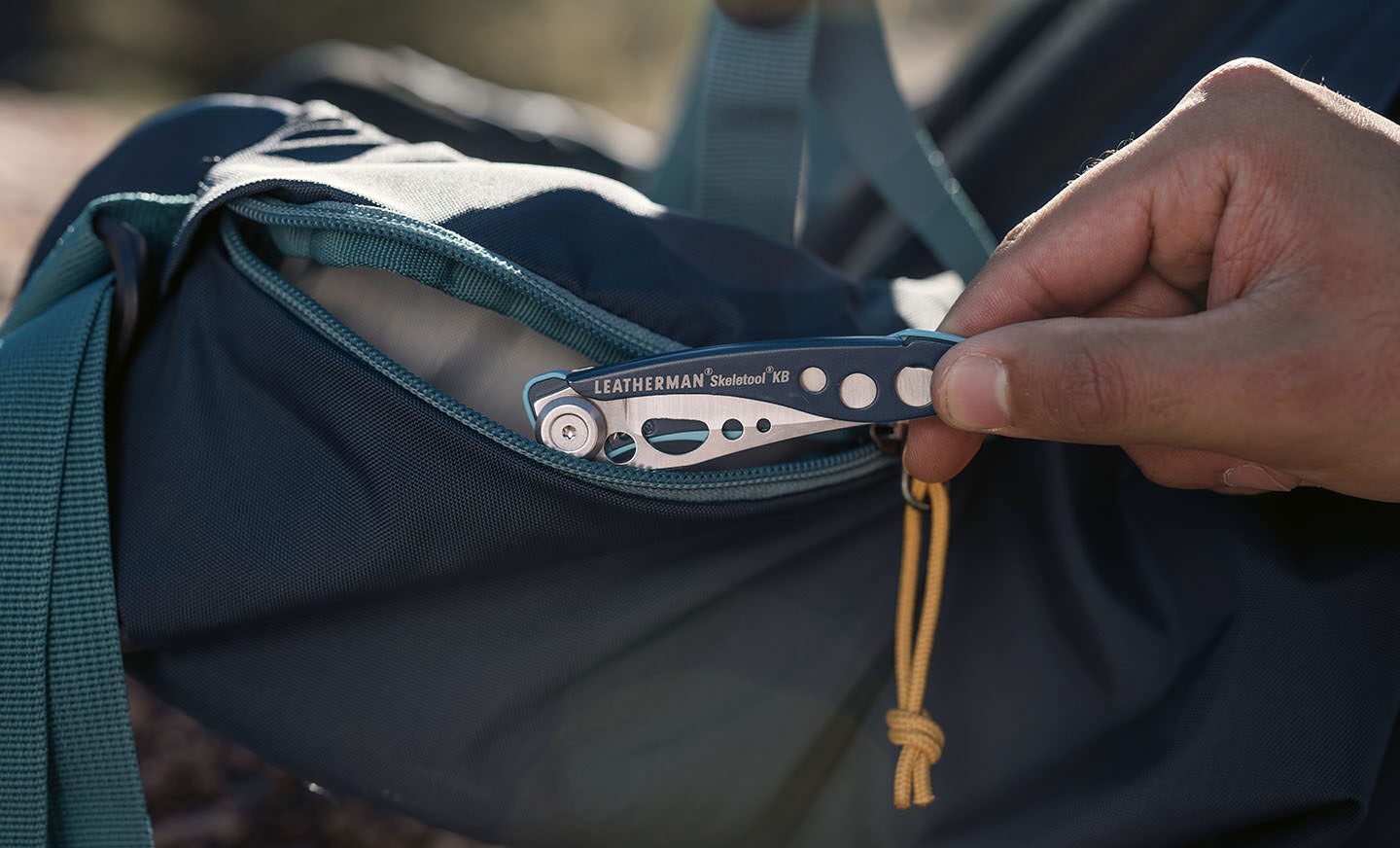 Nightshade Leatherman KB coming out of hiking pack
