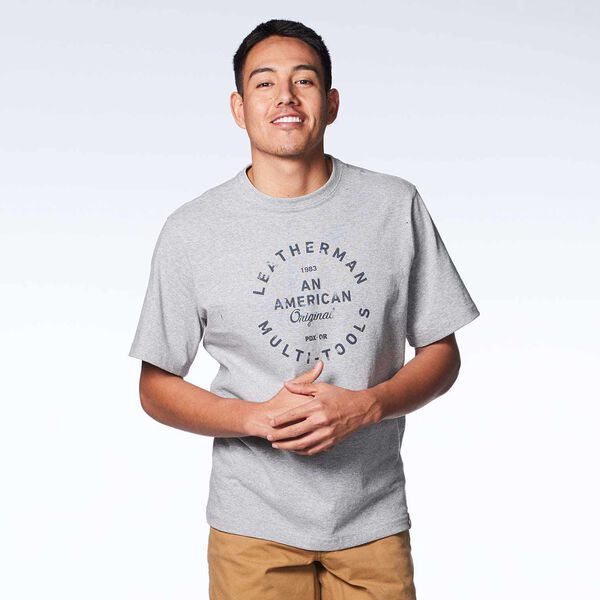 Gray short sleeve T-Shirt with heritage badge on a model front