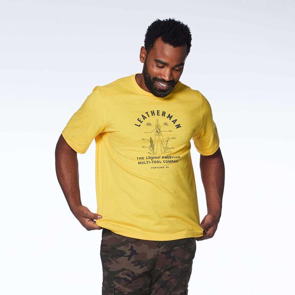 Yellow short sleeve T-Shirt with PST badge on a model front