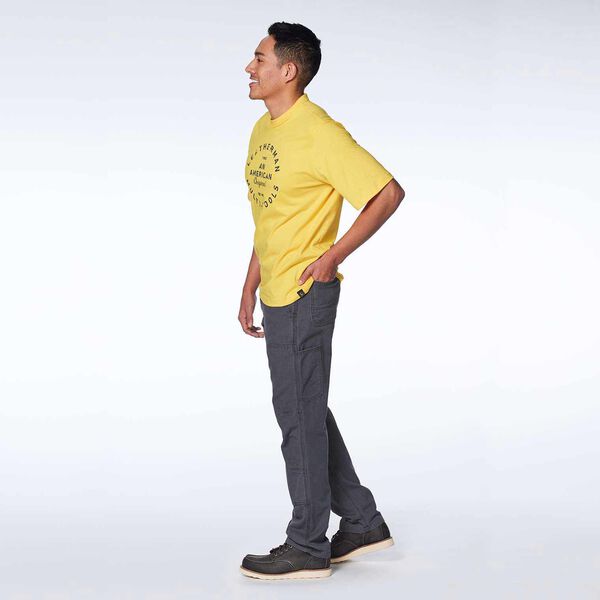 Yellow short sleeve T-Shirt with heritage badge on a male model side