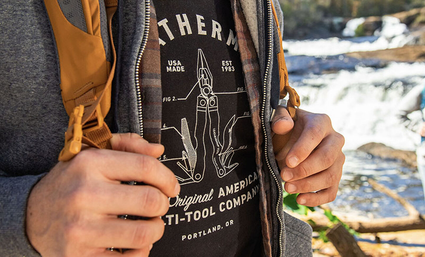 Outdoor enthusiast wears Leatherman PST Heritage Tee in black while hiking.