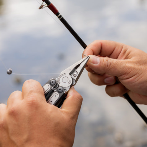 Using a Leatherman Arc to hold a fishing hook