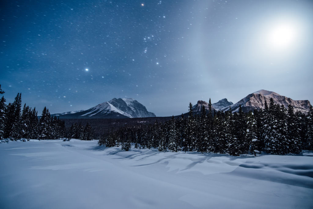 Night time photo of snowy mountains in central Alberta. Temperatures dropped below -30f while photographing this scene.
