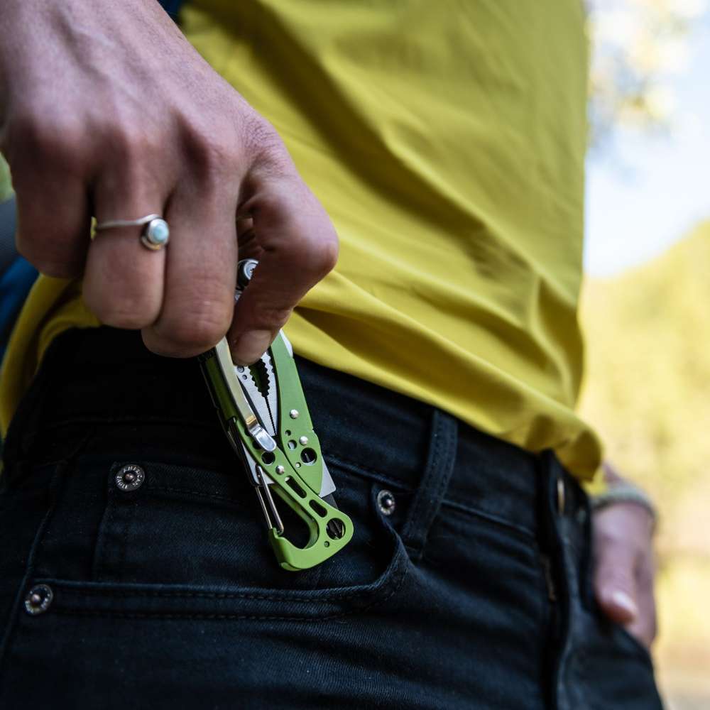 Leatherman Skeletool being pulled from a pocket