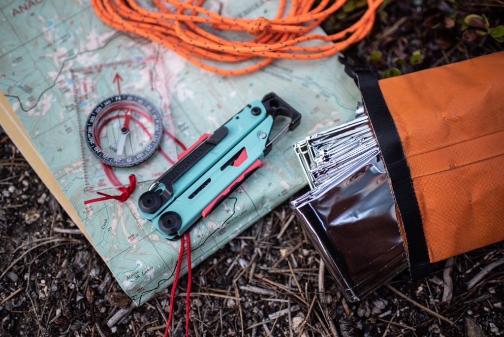 Leatherman Signal, compass, map, roap, and emergency blanket.
