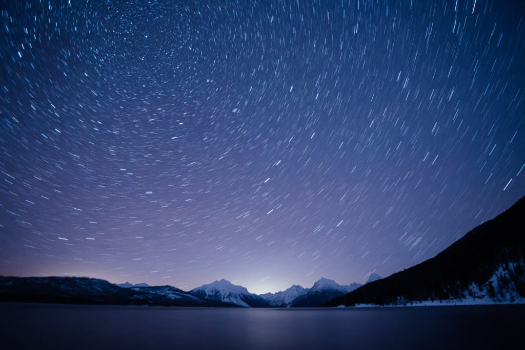 Winter long exposure image of the night sky. Star trails come to life in the Montana sky by utilizing a shutter speed of five minutes.
