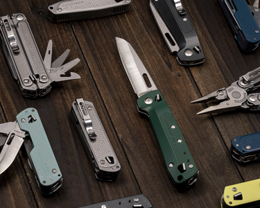 many leatherman free series tools on a table