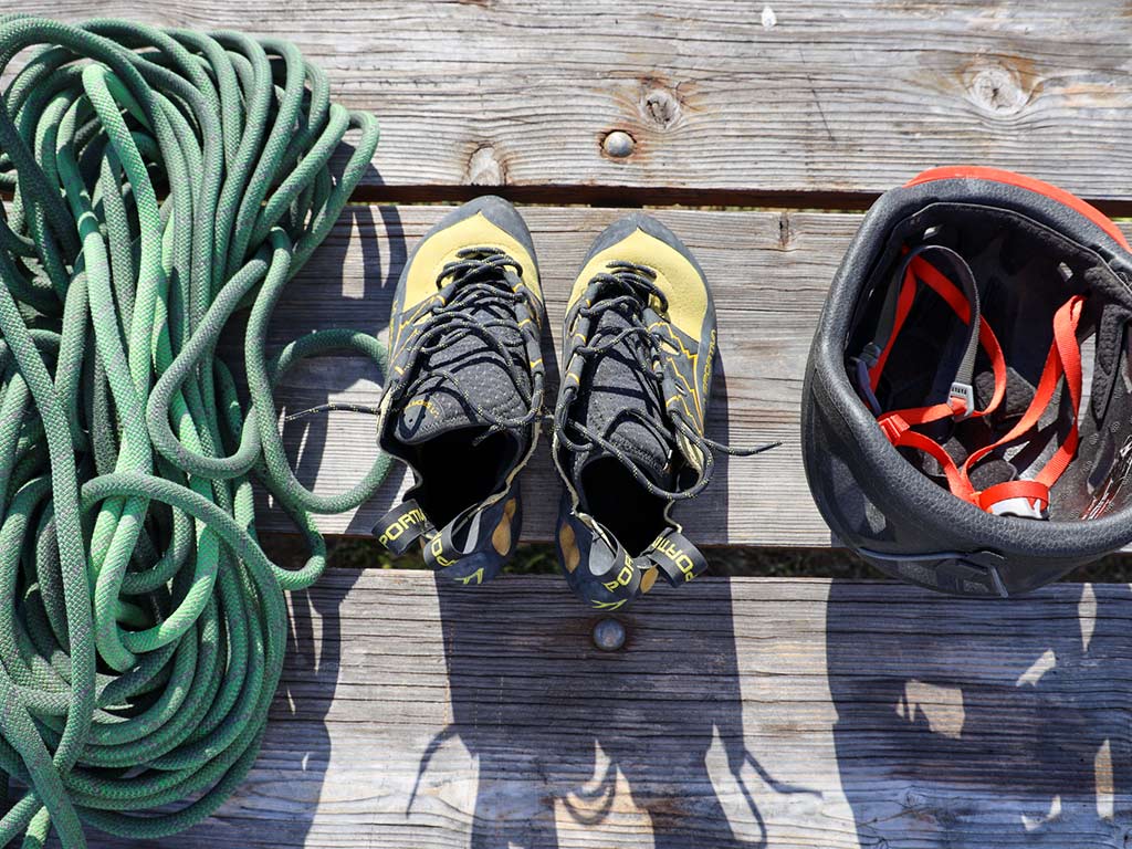 Rock climbing rope, shoes and helmet