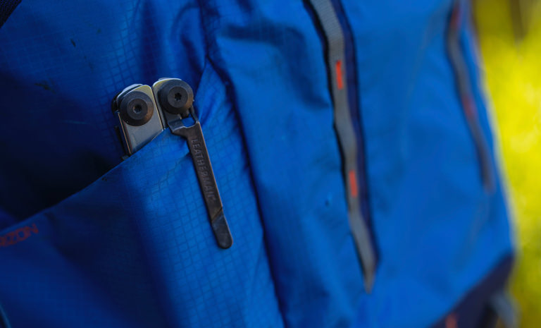 leatherman black & silver signal multi-tool in backpack