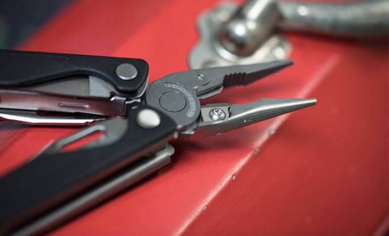 Leatherman charge plus multi-tool on red tool box, open view